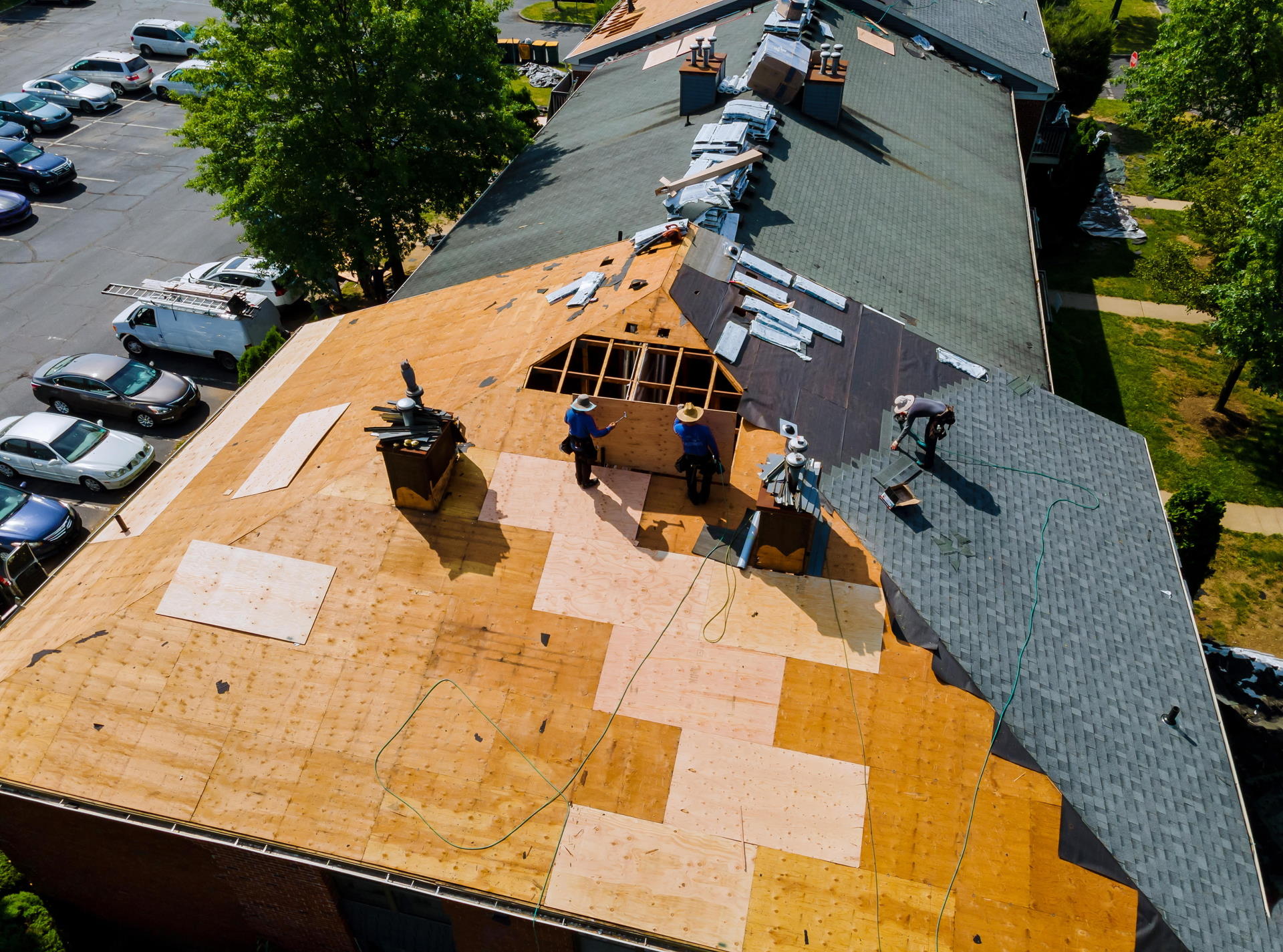 Overhead view of Xterior Pro crew inspecting and working on a residential rooftop
