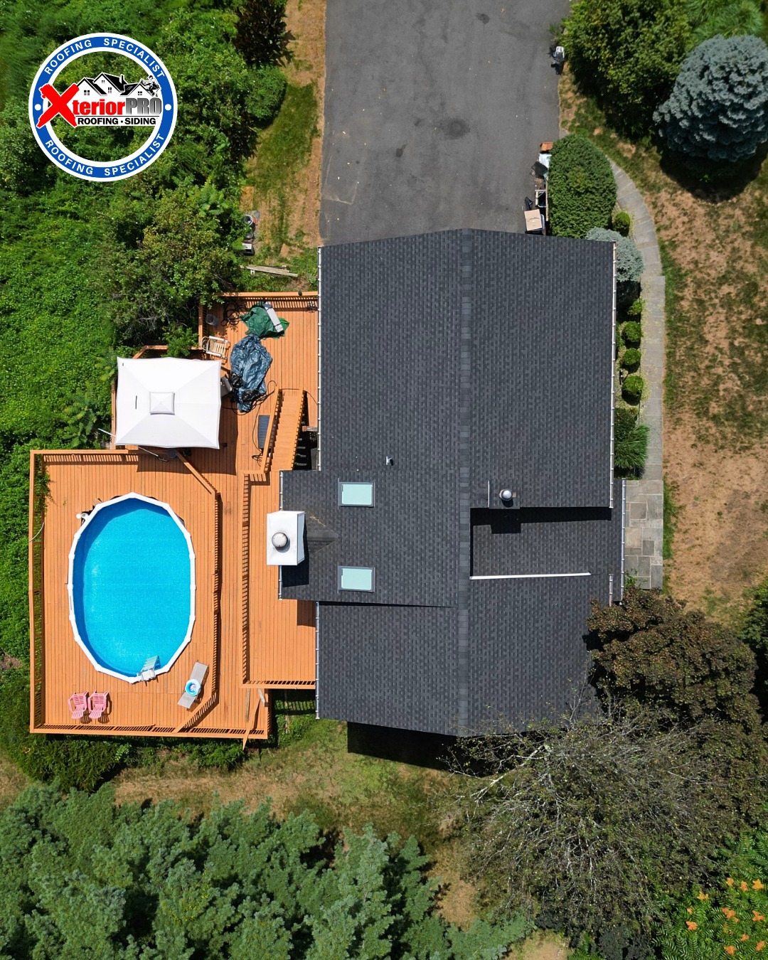 Overhead drone view of a completed GAF Timberline HDZ charcoal shingle roof on a residential home in Newburgh, NY